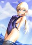  1girl arms_behind_back artoria_pendragon_(all) blonde_hair blue_eyes blue_sky cloud commentary_request competition_swimsuit cowboy_shot day dutch_angle fate/grand_order fate/stay_night fate_(series) free_note017 green_eyes looking_at_viewer one-piece_swimsuit outdoors purple_swimsuit saber sky soaking_feet solo standing swimsuit water 