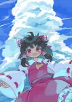  1girl :d ascot bangs black_hair blue_sky bow cloud cowboy_shot detached_sleeves eyebrows_visible_through_hair frilled_skirt frills from_below hair_bow hair_tubes hakurei_reimu highres kibisake looking_at_viewer medium_hair open_mouth outdoors red_bow red_eyes red_shirt red_skirt ribbon-trimmed_sleeves ribbon_trim shirt skirt sky smile solo standing touhou wide_sleeves yellow_neckwear 