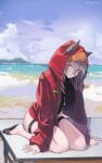  1girl absurdres animal_ears arknights backingbutterfly beach black_footwear black_swimsuit chinese_commentary commentary_request grey_hair highres hood hood_up hooded_jacket jacket long_sleeves looking_at_viewer official_alternate_costume on_table one-piece_swimsuit open_clothes open_jacket outdoors projekt_red_(arknights) projekt_red_(light_breeze)_(arknights) red_jacket short_hair sidelocks sitting solo swimsuit table tail thigh_strap wariza wolf_ears wolf_girl wolf_tail yellow_eyes 