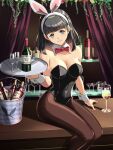  1girl alcohol animal_ears black_hair black_leotard black_pantyhose blue_eyes bow bowtie breasts chiga_akira cleavage counter cup curtains detached_collar drinking_glass fake_animal_ears feet_out_of_frame highres ice_bucket leotard medium_breasts medium_hair original pantyhose playboy_bunny rabbit_ears rabbit_tail red_bow red_bowtie sitting smile solo strapless strapless_leotard tail wine wine_glass wrist_cuffs 
