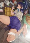  1girl ass barefoot blue_hair blue_shorts blush food game_console gym_uniform hair_ornament high_ponytail highres holding indoors looking_at_viewer looking_back lying mouth_hold multicolored_clothes nintendo_switch on_stomach orange_eyes original pairan panties_under_shorts playing_games pocky ponytail short_shorts shorts soles solo 