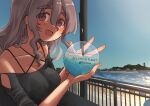  1girl absurdres alternate_costume bare_shoulders beach black_shirt blue_sky breasts brown_eyes cleavage cup day drinking_straw grey_hair hair_between_eyes highres holding holding_cup kantai_collection large_breasts large_hands long_hair looking_at_viewer mizunototori open_mouth outdoors pola_(kancolle) railing shirt sky solo thick_eyebrows upper_body water 