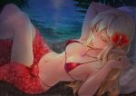  1girl :o bikini blonde_hair collarbone elf flower from_above hair_between_eyes hair_flower hair_ornament highres jewelry long_hair looking_at_viewer micro_bikini necklace night original palm_tree pointy_ears red_eyes restrained sarong sasagawa_(haikaiki) solo swimsuit tree water 