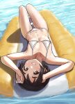  1girl absurdres alternate_costume bangs bare_arms bare_legs bare_shoulders barefoot bikini black_hair blush brown_eyes commentary_request day flat_chest from_above grin highres inflatable_raft kantai_collection kibitarou looking_at_viewer lying maru-yu_(kancolle) micro_bikini navel on_back outdoors short_hair smile solo string_bikini swimsuit upside-down water wet white_bikini 