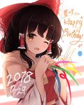  1girl 2018 ascot bangs black_hair breasts brown_eyes brown_neckwear brown_scarf confetti detached_sleeves english_text eyebrows_visible_through_hair hair_ornament hair_tubes hakurei_reimu hands_up highres hunya long_sleeves medium_breasts one_eye_closed open_mouth red_shirt red_skirt scarf shirt short_hair skirt smile solo striped striped_background touhou v white_background wide_sleeves yellow_neckwear 