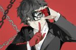  1boy amamiya_ren bangs black_eyes black_hair black_jacket cellphone chain covering_mouth gloves hand_over_own_mouth highres holding holding_phone index_finger_raised jacket long_sleeves looking_at_viewer male_focus mask persona persona_5 phone red_background red_gloves shirt single_glove smartphone smile solo upper_body white_shirt wing_collar xing_20 