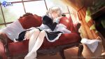  1girl apron azur_lane bangs black_dress blonde_hair blush braid breasts chain collar couch curtains dress dutch_angle eyebrows_visible_through_hair eyes_visible_through_hair french_braid hair_over_one_eye half-closed_eye highres juliet_sleeves laundry_basket leaning_to_the_side legs light_rays long_hair long_sleeves looking_at_viewer maid maid_headdress medium_breasts metal_collar nima_(niru54) no_shoes official_art on_couch one_eye_closed parted_lips puffy_sleeves sheffield_(azur_lane) sunbeam sunlight thighhighs towel waking_up white_apron white_legwear white_towel window yellow_eyes 