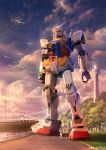  1boy amuro_ray assault_visor bodysuit commentary_request copyright_notice earth_federation gundam harbor helmet highres mecha mecha_pilot_suit mobile_suit mobile_suit_gundam normal_suit_(gundam) official_art outdoors pilot realistic robot rx-78-2_gundam science_fiction ship simple_bird tower tree v-fin walking watercraft white_bodysuit yokohama you_shimizu 