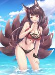  1girl :d akagi_(azur_lane) akagi_(paradise_amaryllis)_(azur_lane) animal_ears arm_support azur_lane bangs bare_shoulders bent_over bikini blunt_bangs blurry breasts brown_hair cleavage collarbone commentary depth_of_field eyebrows_visible_through_hair eyeshadow finger_to_mouth flower fox_ears fox_girl fox_tail hair_flower hair_ornament highres horizon index_finger_raised kyousaki_nao kyuubi long_hair looking_at_viewer makeup midriff multiple_tails navel open_mouth red_bikini red_eyes sidelocks smile solo swimsuit tail wet wet_clothes wet_swimsuit wrist_cuffs 