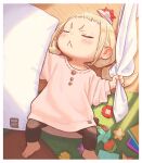  1girl :&lt; blonde_hair child closed_eyes commentary indoors kozato_(yu_kozato) low_twintails lying on_back origami original oversized_clothes paper_hat paper_kabuto pillow pink_shirt ribbon-trimmed_skirt ribbon_trim shirt short_twintails sleeping twintails 