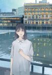  1girl black_hair building buttons collared_dress commentary_request cowboy_shot dress grey_eyes hand_up kyoto looking_at_viewer medium_hair original outdoors parted_lips railing real_world_location reflective_water river short_sleeves solo wamizu white_dress 