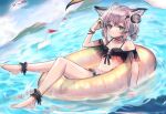  1girl ahoge animal_ears ankle_cuffs arknights bikini bird black_bikini blue_eyes blush brown_hair commentary dutch_angle fox_ears full_body headphones innertube looking_at_viewer official_alternate_costume outdoors seagull shipi_(qlenf0715) short_hair short_twintails sitting solo sussurro_(arknights) sussurro_(summer_flowers)_(arknights) swimsuit twintails water wet 