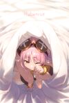  1girl baggy_clothes bangs bed_sheet blush button_eyes character_name echo_(circa) fate/grand_order fate_(series) habetrot_(fate) hat long_hair long_sleeves looking_at_viewer one_eye_closed pink_coat pink_hair pink_headwear pointy_ears red_eyes solo waking_up 