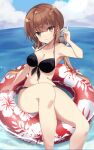  1girl bikini black_bikini black_bow blue_sky bow breasts brown_eyes brown_hair cleavage cloud day fathom floral_print hair_bow horizon innertube kantai_collection long_hair looking_at_viewer low_twintails medium_breasts ocean outdoors sky solo swimsuit tashkent_(kancolle) twintails water 