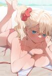 1girl barefoot beach bikini blonde_hair blue_eyes bracelet breasts closed_mouth collarbone commentary earrings english_commentary florida-chan_(ryusei_hashida) hair_between_eyes hair_ornament hair_scrunchie highres jewelry large_breasts looking_at_viewer lying mixed-language_commentary ocean on_stomach original outdoors pout red_bikini red_scrunchie ryusei_hashida scrunchie side_ponytail soles solo star_(symbol) star_earrings swimsuit tan tanlines thighs 