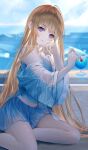  1girl arm_support artist_name bangs blonde_hair blue_shirt blue_skirt blue_theme blurry blurry_background blush cup expressionless hand_up head_tilt long_hair long_sleeves looking_at_viewer nekoyama_iori original outdoors parted_lips purple_eyes shirt sitting skirt solo summer 