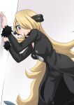  1girl absurdres against_wall black_jacket black_pants blonde_hair blush breasts cleavage commentary_request cynthia_(pokemon) fur-trimmed_sleeves fur_collar fur_trim gible grey_background hair_ornament hair_over_one_eye highres jacket leaning_forward long_hair long_sleeves looking_at_viewer medium_breasts pants pokemon pokemon_(creature) pokemon_dppt solo_focus standing tororonoyama very_long_hair 