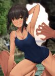  1girl armpits bare_arms bare_legs bare_shoulders black_hair black_swimsuit blush breasts cleavage closed_mouth collarbone dark-skinned_female dark_skin eyebrows_visible_through_hair fubuki_(kancolle) green_eyes hair_between_eyes highres ichikawa_feesu kantai_collection medium_breasts one-piece_swimsuit one_eye_closed rock short_hair short_ponytail smile solo_focus swimsuit tongue tongue_out water 