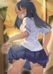  1girl black_hair blue_skirt blush brown_eyes clenched_teeth cloud dark-skinned_female dark_skin from_behind highres ijiranaide_nagatoro-san long_hair looking_at_viewer looking_back nagatoro_hayase orange_sky sakurami_sumi school_uniform shirt skirt sky smile solo sunset teeth thighs white_shirt 