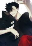  1boy bangs black_hair black_shirt doll_hug grin haikyuu!! hair_between_eyes highres kuroo_tetsurou looking_at_viewer male_focus mgmg_1012 object_hug pants red_pants shirt short_hair smile solo stuffed_animal stuffed_cat stuffed_toy teeth yellow_eyes 