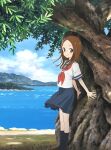  1girl blue_skirt blush brown_eyes brown_hair closed_mouth cloud day forehead full_body giant_tree highres karakai_jouzu_no_takagi-san long_hair looking_at_viewer neckerchief ocean outdoors pleated_skirt red_neckwear sailor_collar school_uniform serafuku shirt short_sleeves skirt smile solo standing takagi-san tree under_tree 