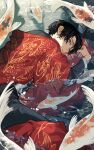  1boy animal_print black_hair black_shirt blue_eyes cape fish_print highres jacket japanese_clothes koi looking_back lying original partially_submerged red_cape red_jacket shirt short_hair solo uminonew water 