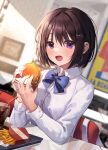  1girl absurdres bangs black_hair blue_bow blue_neckwear blurry blurry_background blush bow bowtie burger chair cola collared_shirt cup dress_shirt food french_fries hair_ornament hairclip highres holding holding_food indoors long_sleeves looking_at_viewer myowa open_mouth original purple_eyes school_uniform shirt short_hair sitting smile soda solo table white_shirt 