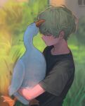  1boy absurdres animal bangs bird black_shirt blurry blurry_background blush closed_eyes duck from_side grass green_hair hair_between_eyes highres holding holding_animal holding_bird male_focus octocorn original outdoors parted_lips profile shirt short_sleeves signature 