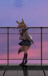  1girl alternate_costume animal_ears black_legwear blonde_hair blue_skirt commentary_request extra_ears eyebrows_visible_through_hair fennec_(kemono_friends) fox_ears fox_girl fox_tail highres kemono_friends long_sleeves looking_at_viewer multicolored_hair nanana_(nanana_iz) neckerchief no_shoes pleated_skirt red_neckwear rooftop sailor_collar school_uniform serafuku shirt shoes short_hair skirt socks solo standing standing_on_one_leg sunset tail two-tone_hair white_hair white_shirt yellow_eyes 