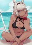  1girl absurdres animal_ears bangs bare_shoulders beach bikini binyamin black_bikini blue_eyes blue_sky body_markings breasts caenis_(fate) caenis_(swimsuit_rider)_(fate) cleavage collarbone dark-skinned_female dark_skin fate/grand_order fate_(series) hairband highres indian_style large_breasts long_hair looking_at_viewer navel shore sitting sky solo swimsuit very_long_hair white_hair 