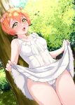  1girl :d absurdres bangs bare_shoulders blush cameltoe clothes_lift covered_navel dress dress_lift eyebrows_visible_through_hair flower_wreath hair_between_eyes highres hoshizora_rin lifted_by_self linatai looking_at_viewer love_live! love_live!_school_idol_project nose_blush open_mouth orange_hair outdoors panties short_hair smile solo spaghetti_strap sundress thigh_gap tree underwear white_dress white_panties yellow_eyes 