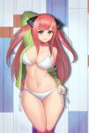  1girl absurdres arm_behind_head arm_up bangs bikini black_ribbon blue_eyes blunt_bangs blush breasts collarbone go-toubun_no_hanayome green_hoodie halterneck highres hime_cut hiroshi_(beolcoyote) hood hoodie large_breasts long_hair looking_at_viewer nakano_nino navel pink_hair ribbon side-tie_bikini stomach string_bikini swimsuit thick_thighs thighs twintails v-shaped_eyebrows white_bikini 