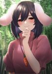  1girl absurdres animal_ears bamboo bamboo_forest black_hair blush carrot_necklace closed_mouth commentary_request dress forest hair_between_eyes highres inaba_tewi keenii_(kenny86) looking_at_viewer nature pink_dress puffy_short_sleeves puffy_sleeves rabbit_ears red_eyes short_hair short_sleeves smile solo touhou upper_body 