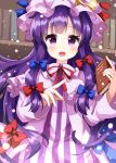 1girl :d bangs blue_bow book bookshelf bow crescent crescent_pin dress eyebrows_visible_through_hair hair_bow hat highres holding holding_book long_hair long_sleeves looking_at_viewer mob_cap multiple_bows open_mouth patchouli_knowledge purple_eyes purple_hair purple_headwear red_bow red_neckwear ruu_(tksymkw) sidelocks smile solo striped striped_dress touhou 