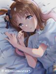  1girl animal_ears blue_eyes blush brown_hair ear_bow ear_ribbon eyebrows_visible_through_hair grass_wonder_(umamusume) highres horse_ears horse_girl long_hair looking_at_viewer lying multicolored_hair on_bed on_side open_mouth puffy_short_sleeves puffy_sleeves shirt short_sleeves solo streaked_hair twitter_username umamusume upper_body wasabi_master white_hair white_shirt 