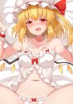  1girl bangs bed blonde_hair blush breasts collarbone commentary_request eyebrows_visible_through_hair flandre_scarlet hair_between_eyes hat highres looking_at_viewer lying mob_cap navel one_side_up open_mouth out-of-frame_censoring red_eyes short_hair small_breasts smile solo stomach tksand touhou white_headwear wings 