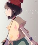  1girl bag bangs beanie blush bracelet brown_hair closed_mouth eyebrows_visible_through_hair floral_print from_side green_shorts hat highres jewelry pokemon pokemon_(game) pokemon_sm red_headwear selene_(pokemon) shirt short_sleeves shorts shoulder_bag signature solo t-shirt tere_asahi tied_shirt z-ring 