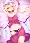  1girl arms_up black_panties blonde_hair bow bow_panties breasts clothes_pull collarbone commentary_request cowboy_shot dutch_angle flandre_scarlet groin half-closed_eyes hat highres long_hair lying mob_cap navel on_back on_bed panties parted_lips red_eyes red_skirt red_tank_top skirt skirt_pull small_breasts solo tank_top tomoe_(fdhs5855) touhou underwear white_headwear wings 
