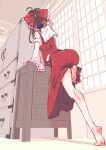  1girl absurdres ass bare_legs barefoot black_hair bow chest_of_drawers detached_sleeves feet from_behind from_below hair_bow hair_tubes hakurei_reimu highres leg_up long_hair non_(z-art) red_bow red_shirt red_skirt ribbon-trimmed_sleeves ribbon_trim shirt shouji skirt sleeveless sleeveless_shirt sliding_doors solo thighs touhou 