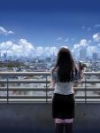  1girl black_hair blue_sky building camera city cityscape cloud commentary_request fence geshi holding house kneehighs long_hair original scenery shirt skirt sky skyline skyscraper solo 