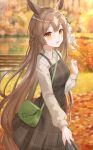  1girl animal_ears autumn autumn_leaves bag bangs braid brown_hair eyebrows_behind_hair eyebrows_visible_through_hair hair_between_eyes hair_ornament handbag highres holding holding_cloth holding_clothes horse_ears horse_girl horse_tail leaf long_hair looking_at_viewer maple_leaf open_mouth orange_eyes satono_diamond_(umamusume) smile solo tail ugi_(ugi_rns) umamusume 