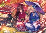  2girls :d architecture blue_eyes blue_flower blue_kimono blurry blurry_background blush bridge brown_hair depth_of_field east_asian_architecture flower forest geta green_sash hair_flower hair_ornament hanikami_kanojo highres holding holding_umbrella japanese_clothes kimono leaf long_hair long_sleeves looking_at_another looking_down maple_leaf minazumi_kasane multiple_girls nature obi oil-paper_umbrella piromizu purple_umbrella red_flower red_kimono red_umbrella river rock sash shoudou_erena smile squatting stitched tabi umbrella white_legwear wide_sleeves 