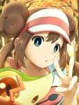 1girl :o bangs blush bow bright_pupils brown_hair commentary day double_bun green_eyes hand_up highres itsudzumi long_hair outdoors pink_bow pokemon pokemon_(creature) pokemon_(game) pokemon_bw2 raglan_sleeves rosa_(pokemon) shirt snivy tree twintails upper_body v visor_cap 