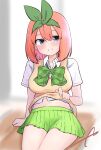  1girl arm_support bangs blue_eyes blurry blurry_background blush bow breasts collared_shirt commentary_request depth_of_field eyebrows_behind_hair eyebrows_visible_through_hair go-toubun_no_hanayome green_bow green_ribbon green_skirt hair_between_eyes hair_ribbon highres kujou_karasuma lifted_by_self looking_at_viewer medium_breasts nakano_yotsuba navel orange_hair pleated_skirt ribbon shirt short_sleeves signature sitting skirt smile solo sweater_vest white_shirt 