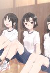  12_graka 3girls absurdres black_hair blue_shorts brown_eyes commentary_request eyebrows_visible_through_hair gym_uniform highres looking_at_viewer multiple_girls open_mouth original ponytail shoes short_hair short_sleeves shorts sitting smile sneakers 
