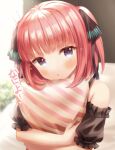  1girl :o absurdres bangs bare_shoulders black_ribbon blue_eyes blush commentary_request diagonal_stripes eyebrows_visible_through_hair go-toubun_no_hanayome hair_ribbon highres looking_at_viewer nakano_nino object_hug parted_lips pillow pillow_hug puffy_short_sleeves puffy_sleeves red_hair ribbon short_sleeves solo striped striped_pillow two_side_up upper_body v-shaped_eyebrows yata_(yatao_zzz) 