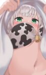  1girl absurdres animal_print ayama_nano bangs bell blurry blurry_foreground blush bra breasts clothes_lift commentary cow_print depth_of_field eyebrows_visible_through_hair from_below green_eyes highres hololive large_breasts lifted_by_self looking_at_viewer looking_down navel print_bra shirogane_noel shirt shirt_lift silver_hair solo underwear upshirt virtual_youtuber white_bra white_shirt 