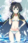  1girl anchor_print bikini black_cape black_hair breasts cape closed_mouth collarbone commentary_request double-parted_bangs elbow_gloves gloves green_eyes hand_on_own_hip hat highres jack_(wkm74959) light_blush looking_at_viewer murasa_minamitsu navel partially_submerged pointing pointing_up sailor_hat short_hair skinny small_breasts smile solo splashing standing striped_bikini striped_clothes swimsuit touhou waves white_bikini white_hat 