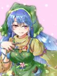  1girl apron arm_ribbon blouse blue_hair commentary_request eyebrows_visible_through_hair flower green_apron green_headwear haniyasushin_keiki head_scarf highres magatama magatama_necklace oshiaki pen pink_background pocket purple_eyes ribbon single_strap smock solo tongue tongue_out tools touhou wood_carving_tool yellow_blouse 