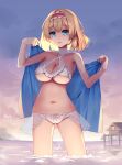  1girl absurdres alice_margatroid bikini blonde_hair blue_eyes blue_towel breasts collarbone cowboy_shot frilled_bikini frilled_hairband frills hairband highres large_breasts looking_at_viewer mechrailgun medium_hair navel outdoors parted_lips plump red_hairband solo sunset swimsuit touhou wading white_bikini 